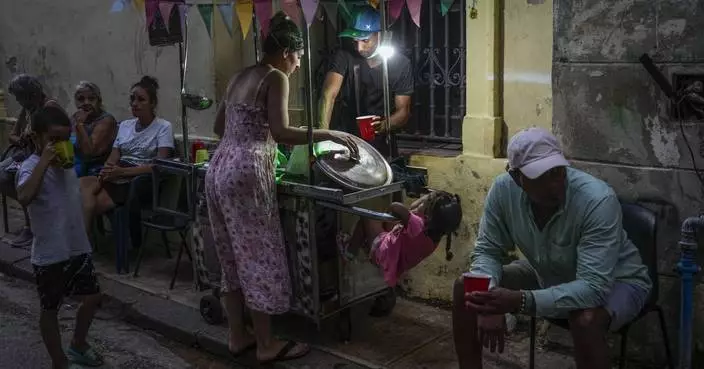 Cuba fights to come back from a nationwide blackout, then a storm that killed six