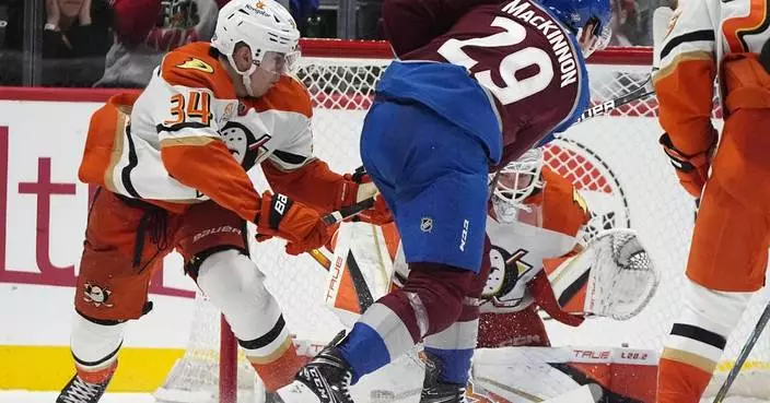 MacKinnon scores in OT to lift Avalanche past Ducks 4-3 for 1st win