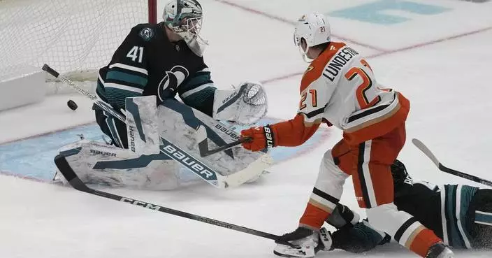 Lundestrom snaps scoreless tie in 3rd and Dostal gets shutout as Ducks blank Sharks 2-0