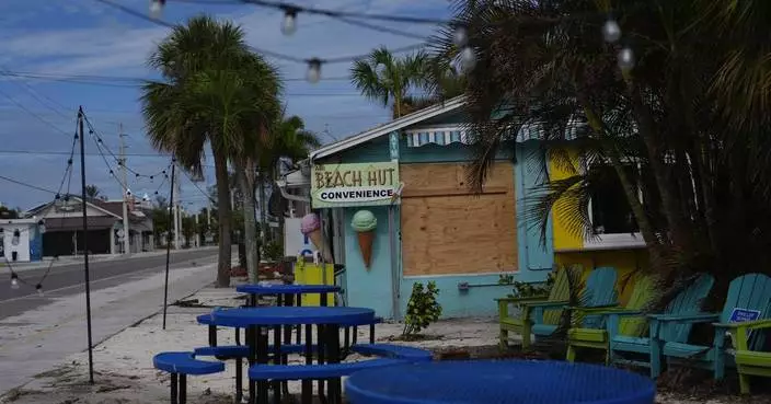 The Latest: Hurricane Milton weakens to Category 1, but danger remains in Florida