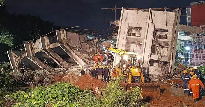 Building collapses during heavy rains in southern India city, killing at least 5 workers