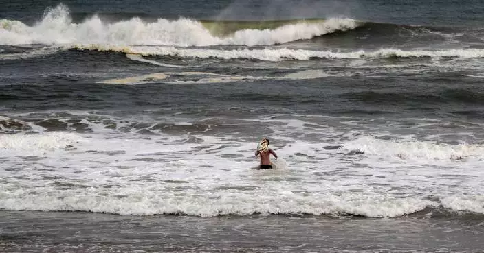 India evacuates hundreds of thousands of people and shuts schools as a tropical storm nears