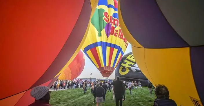 &#8216;Magical&#8217; flotilla of hot air balloons take flight at international fiesta amid warm temperatures