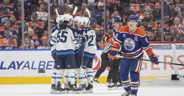 Connor Hellebuyck makes 30 saves, Jets rout Oilers 6-0 in opener