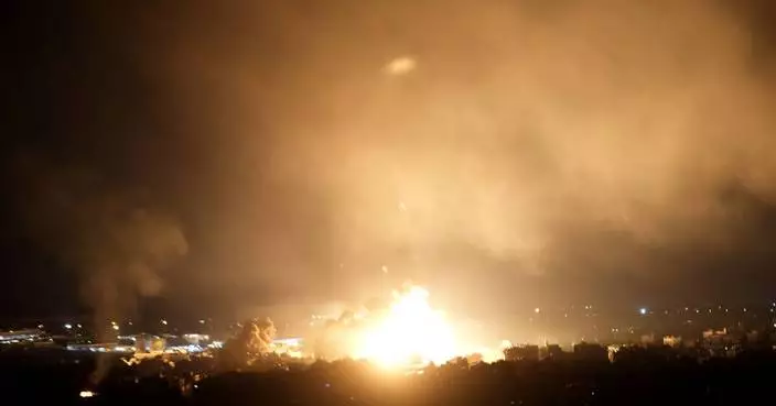 Israeli airstrikes rock southern suburbs of Beirut and cut off a key crossing into Syria