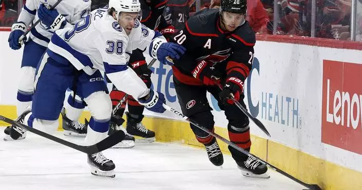 Kucherov scores go-ahead goal, two empty-netters to push Lightning past Hurricanes in season opener