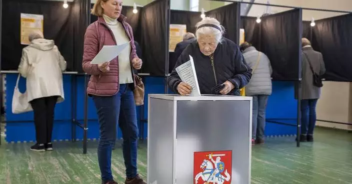 Lithuanians vote in parliamentary election with many looking for change despite a strong economy