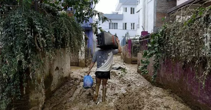 Rescuers search for missing people in Nepal following flooding and landslides that killed 224