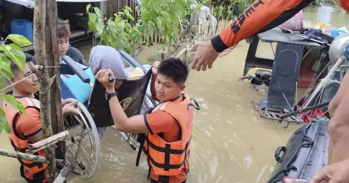 Tropical storm battering Philippines leaves at least 24 people dead in flooding and landslides