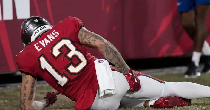 Tampa Bay's Mike Evans injures hamstring vs. Ravens, shortly after catching 100th TD