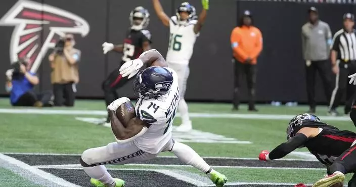 Seahawks wide receiver DK Metcalf carted off field with knee injury in 4th quarter against Falcons