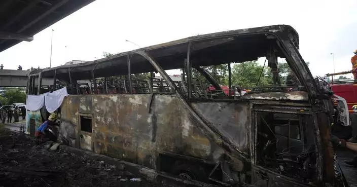 Operator of a Thai bus that caught fire and killed 23 is charged, as investigators suspect gas leak