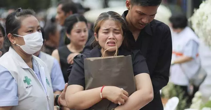 Small town in Thailand hold mass cremation for 23 who died in a school trip bus fire