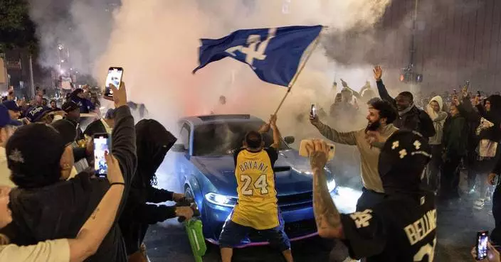 Los Angeles sees city bus burned, store thefts and rowdy crowds after Dodgers win World Series