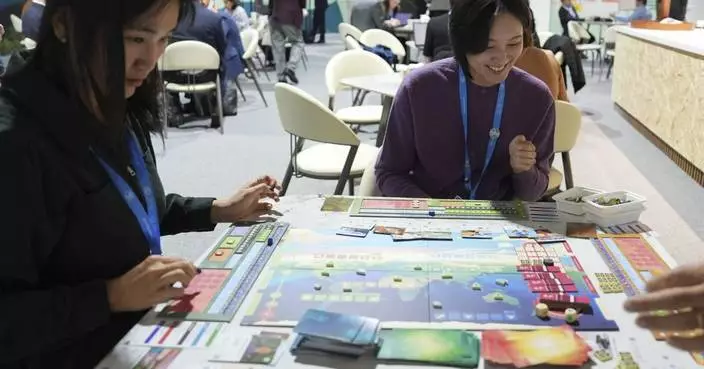 In a board game, climate experts work to save the world, which diplomats at COP29 try in real life