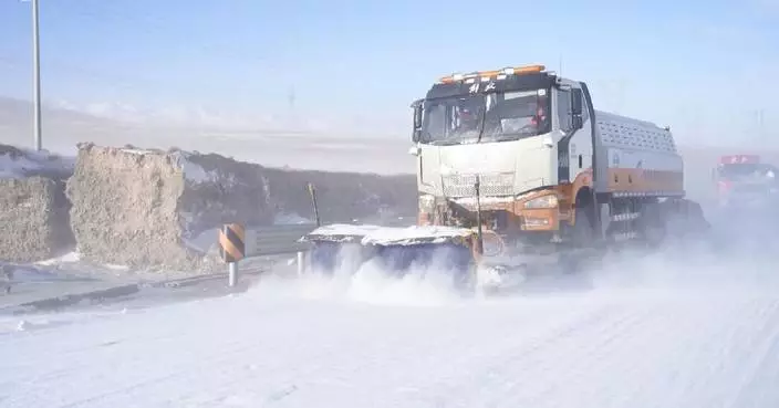 Chinese authorities battle cold wave as snow-covered roads disrupt traffic