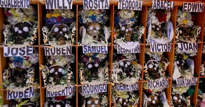 Bolivians carry adorned human skulls asking for favors in the Ñatitas festival in La Paz