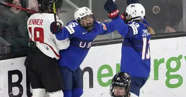 Lacey Eden scores 2 of the United States' 5 goals in the first period and the Americans rout Canada