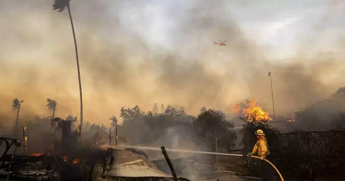 Slower winds aid firefighters battling destructive blaze in California