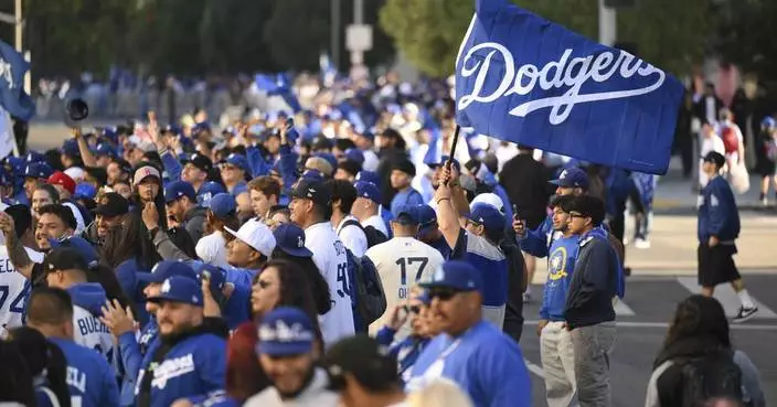 Shohei Ohtani brings his dog and addresses crowd in English as Dodgers celebrate World Series title