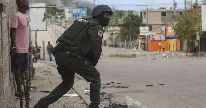 Haiti's main airport and capital frozen a day after a plane was shot by gangs