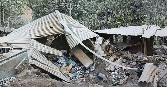 Indonesian rescuers dig through volcanic ash after eruption kills 9 and destroys buildings