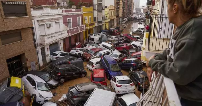 AP PHOTOS: Death by water, burial by mud. Images of Spain's floods of the century