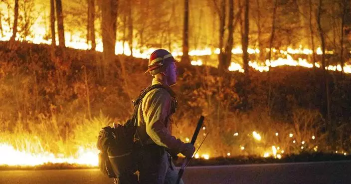 Aided by rain, crews extinguish a wildfire in Nevada after 1 home burns