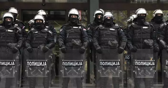 Protesters scuffle with police in Serbia as they demand arrests over a deadly roof collapse