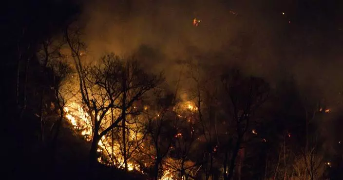 Firefighters are closer to taming the wildfire that's across the New Jersey-New York border