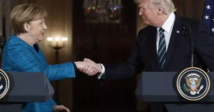 German ex-leader Merkel says she felt sorrow at Trump's comeback and recalls awkward non-handshake