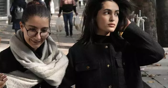 Iran pauses the process to implement a new, stricter headscarf law for women, official says