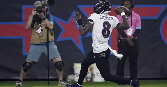 Lamar Jackson breaks NFL QB rushing record, accounts for 3 TDs in Ravens&#8217; 31-2 romp over Texans