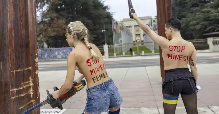 Topless women protesting the Ukraine war are detained for vandalizing sculpture near UN building