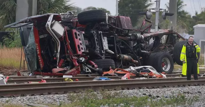 Train collides with fire truck in Florida. Police say 3 firefighters and at least 12 passengers hurt