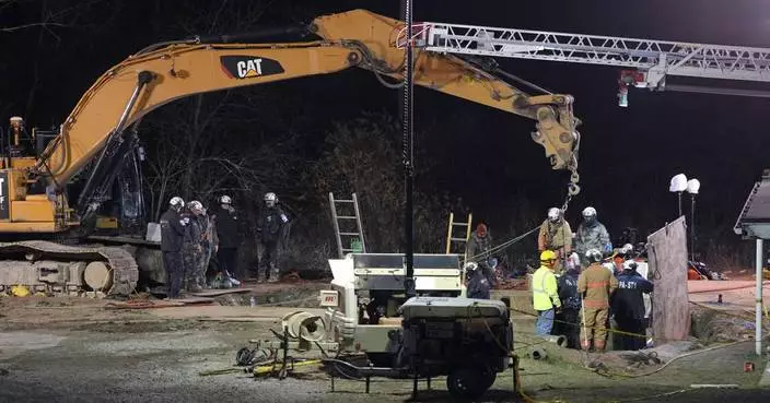 Rescuers search for woman who may have fallen into a sinkhole while looking for her lost cat