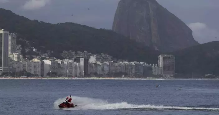 Brazilian Santa swaps sleigh for Jet Ski to deliver toys — and joy — to disabled children in Rio