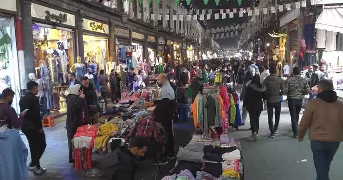 Businesses reopen after lifting of curfew in Damascus