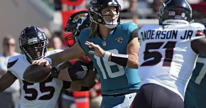 Jaguars QB Trevor Lawrence out with a concussion after violent hit from Texans LB Azeez Al-Shaair