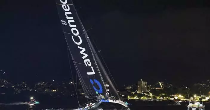 2 sailor deaths result in muted celebrations on winning yacht in Sydney to Hobart race