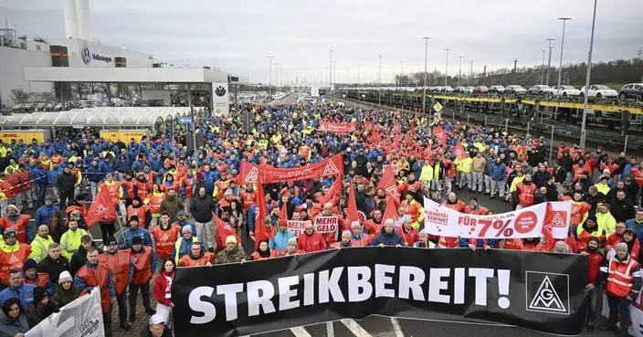 Volkswagen workers hold 2-hour strikes to push back against proposed pay cuts and plant closures