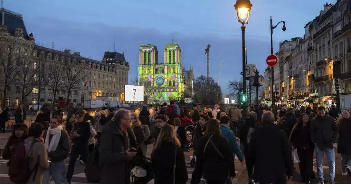 The Latest: The famed Notre Dame Cathedral in Paris reopens to great fanfare