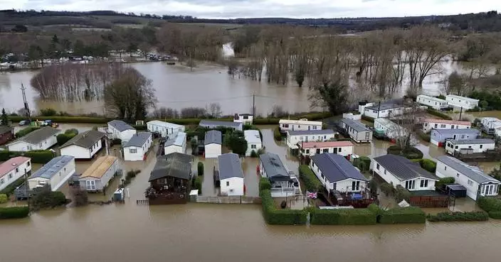 Rain and snow lead to flooding and disrupt travel in parts of the UK