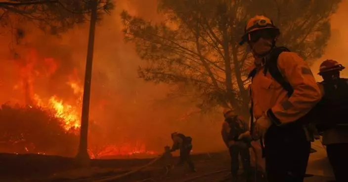 See photos of fire, smoke and flight as wildfires race across Southern California