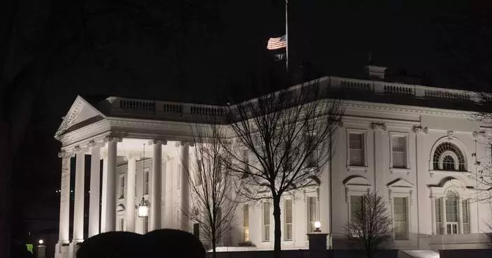 Why are US flags being flown at half-staff on Inauguration Day?