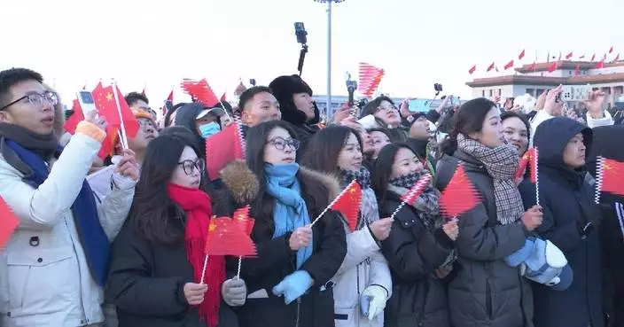 Tourists, locals gather in Tiananmen Square to watch first flag-raising ceremony of 2025