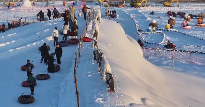 Chinese people enjoy ice, snow activities in Beijing, Shanxi