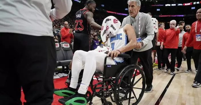 Magic&#8217;s Jalen Suggs leaves game against Raptors in wheelchair because of back spasms