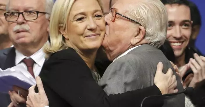 French far-right leader Marine Le Pen pays tribute to her politically polarizing father