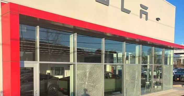 Oregon police investigate nighttime gunshots that shattered windows at a Tesla dealership